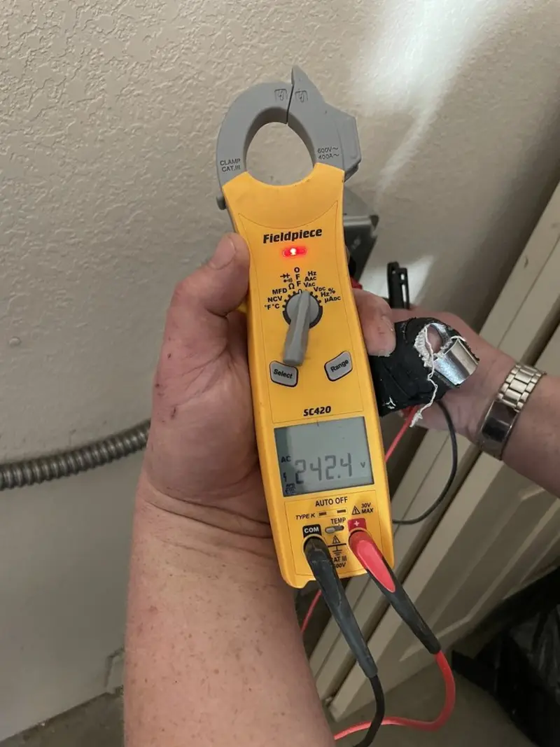 Voltage testing with clamp meter during Recessed Lighting Installation in Sunnyslope